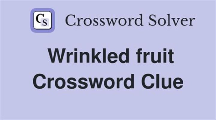 Wrinkled fruit Crossword Clue